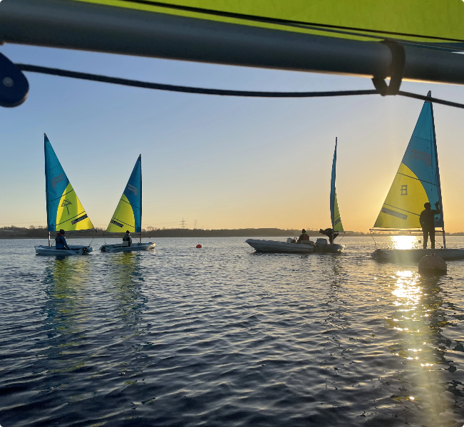 Sailing boats in the sunset.