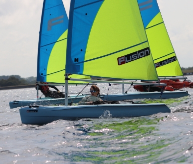 Someone sailing in a catamaran