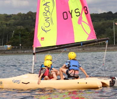 Youths sailing on the water.