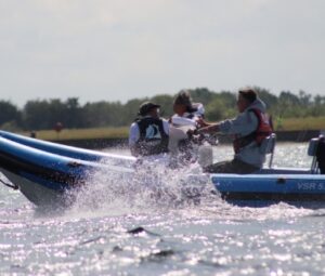 Persons powerboating.