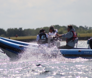 Persons powerboating.