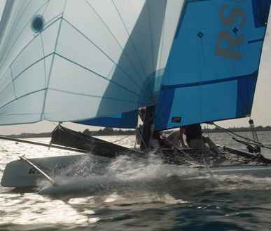 A Catamaran sailing very fast.
