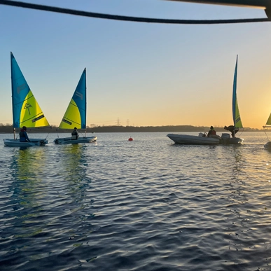 Sailing boats with a sunset
