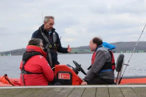 An instructor with students for Powerboating.