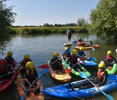 Juniors paddling on the lake.